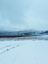 Scenic view of frozen landscape against sky