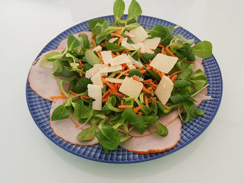 High angle view of chopped vegetables in bowl on table