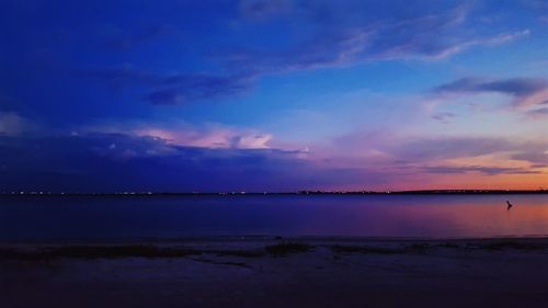 Scenic view of sea against sky at sunset