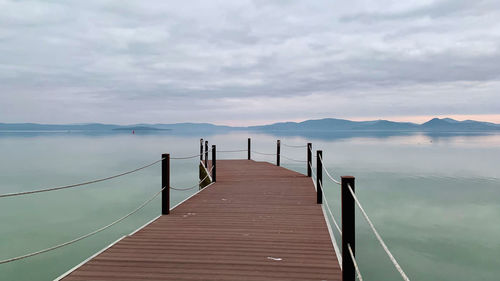 Fog over lake pier atmosphere