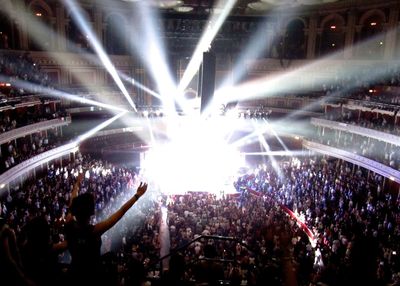 People enjoying concert at night