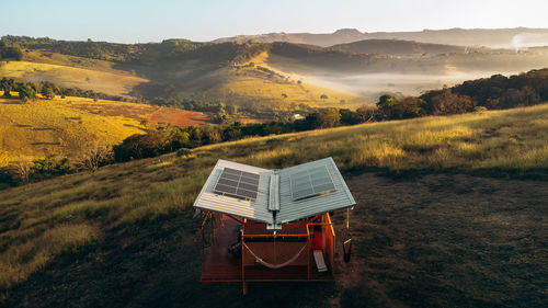 Tiny house overlooking valley with fog in the morning