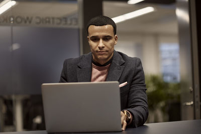 Man using laptop in office