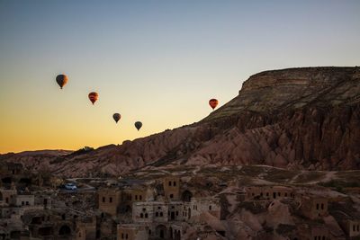 Hot air balloons over mountain