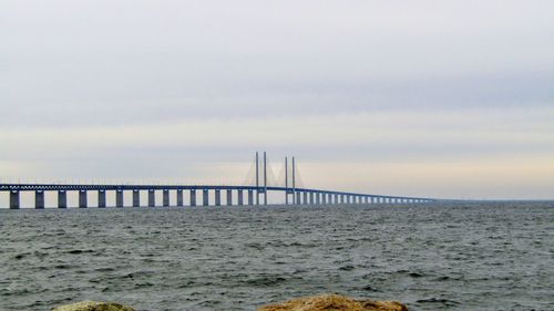 Bridge over sea against sky