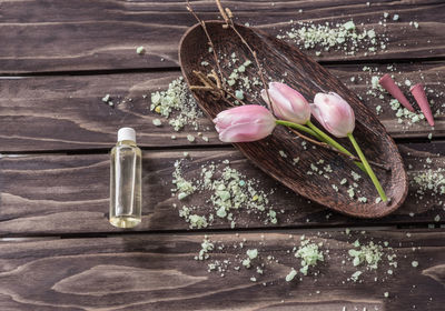 High angle view of spa treatment items on wooden table