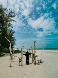 Woman standing at beach