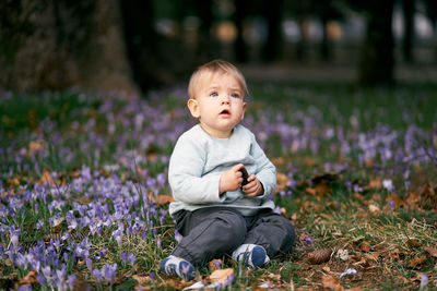 Cute girl sitting on field