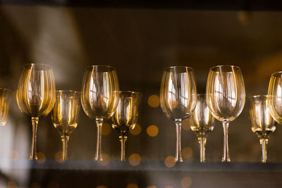 Group of wine glasses standing on the bar in a pub and restaurant