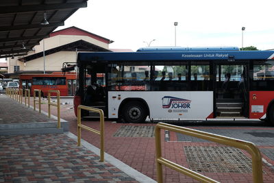 Bus in city against sky