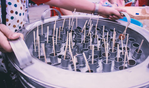 Cropped image of holding ice lollies molds