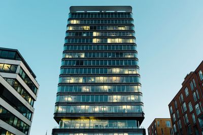 Low angle view of skyscraper against clear sky