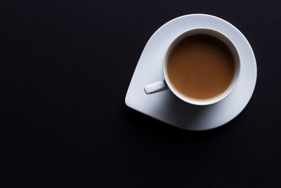 High angle view of coffee cup on table