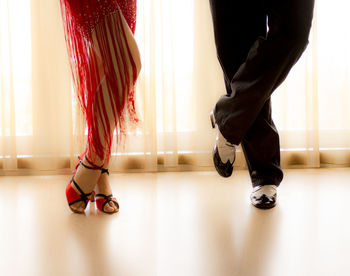 Low section of women standing on floor