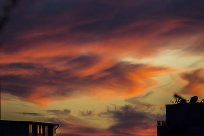 Low angle view of cloudy sky at sunset