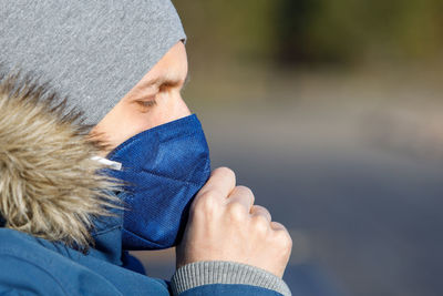 Close-up of man wearing mask outdoors