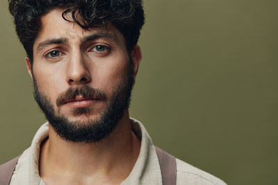 Close-up portrait of young man looking away