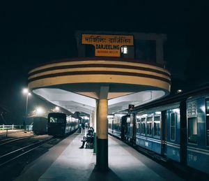 Train at railroad station at night