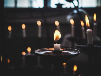 Close-up of candles in church