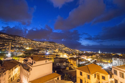 High angle view of illuminated buildings in city against sky