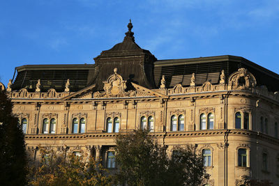 Low angle view of building against blue sky