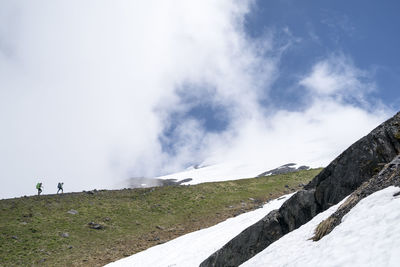 Two female mountaineers hiking on mt. baker, washington