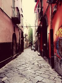 Alley amidst buildings in city