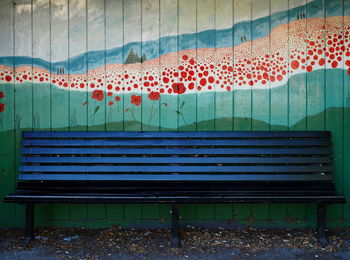 Empty bench in swimming pool