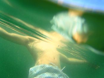 Man swimming in pool