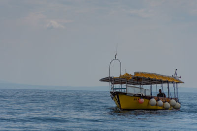 Ship in sea against sky