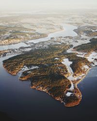 Aerial view of lake against sky during winter