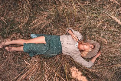 High angle view of people relaxing on field