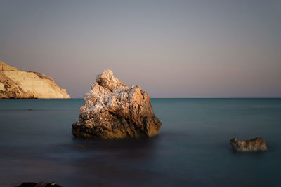 Scenic view of sea against clear sky during sunset