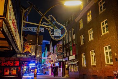 Low angle view of illuminated building at night