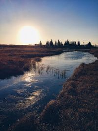 Scenic view of sunset over river