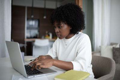 Black woman working remotely from home