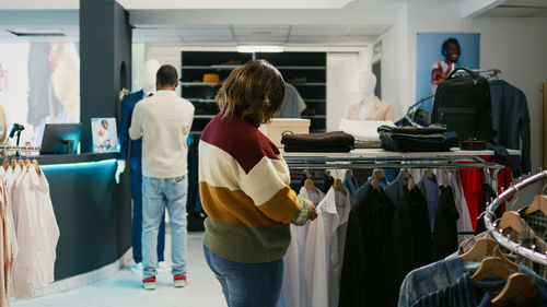 Rear view of woman standing in store