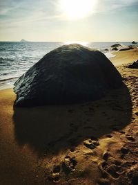 Scenic view of beach against sky during sunset