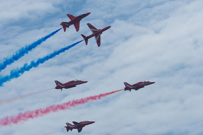 Low angle view of airshow in sky