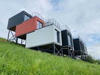 Low angle view of house on field against sky