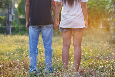 Low section of couple on field