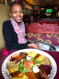 Portrait of smiling woman with vegetables