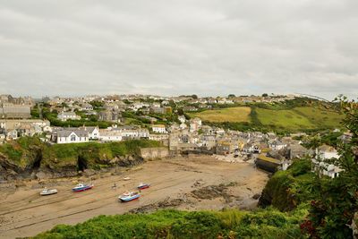 High angle view of port isaac against sky