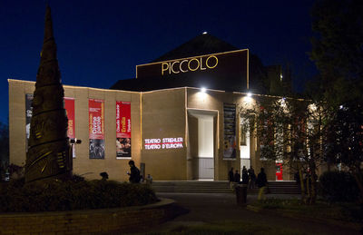 Illuminated text on street at night