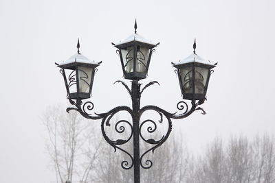 Low angle view of lamp against sky