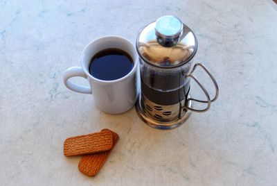 High angle view of coffee cups on table