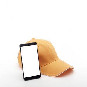 Close-up of mobile phone against white background