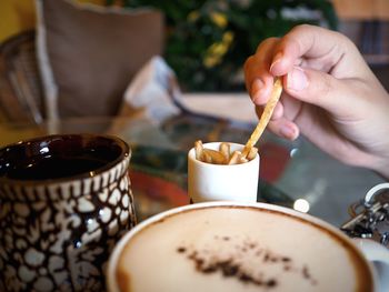 Woman holding coffee cup