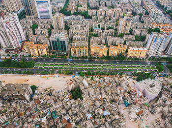 Aerial view of river amidst buildings in city