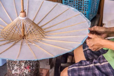 Close-up of woman holding umbrella